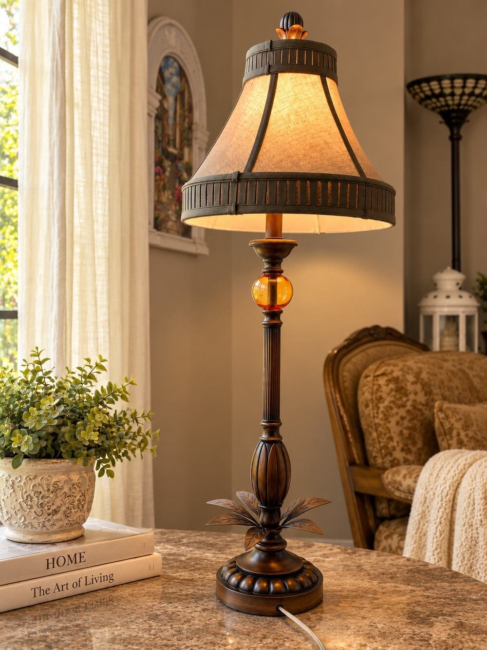 bronze-finish table lamp featuring a fluted stem, an amber-colored glass accent